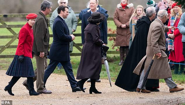 The royals and the equerry: Lt Col Thompson of the 5th Battalion Royal Regiment of Scotland escorts the royals to church on Christmas Eve. The dashing father-of-one lives in Surrey with his wife Caroline