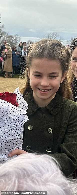 Princess Charlotte beamed as she accepted a bouquet of flowers