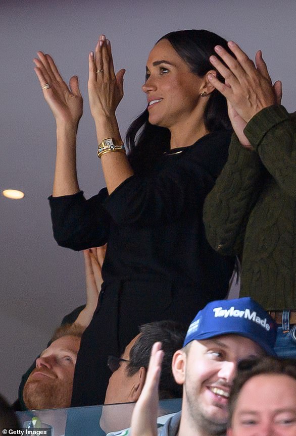 Attending an ice hockey game in Canada, Meghan teamed a repeated outfit with a Lorraine Schwartz Against Evil Eye bracelet costing £14,855.09