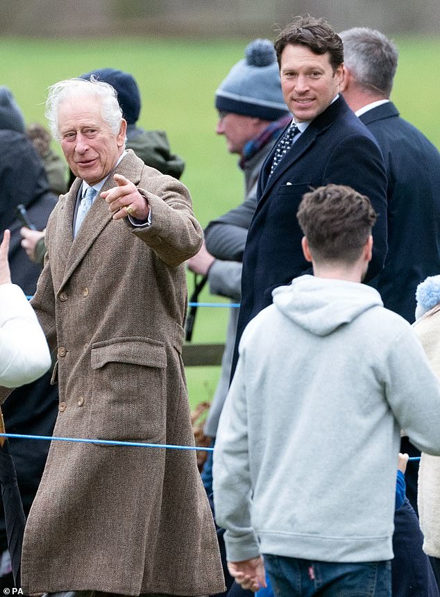 Merry monarch: King Charles pictured alongside his trusted equerry, Lieutenant Colonel Jonathan Thompson, following a Christmas Eve church service at St Mary Magdalene Church in Sandringham, Norfolk