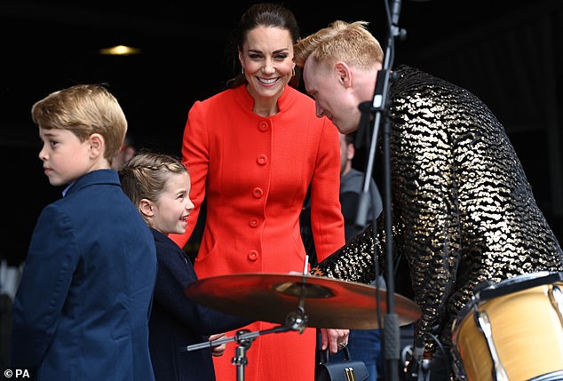 The Princess shakes hands with one of the performers