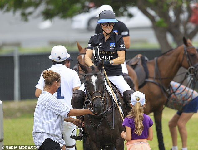 Zara was all smiles as she chatted with others during today's polo game at Doug Jennings Park on the Gold Coast