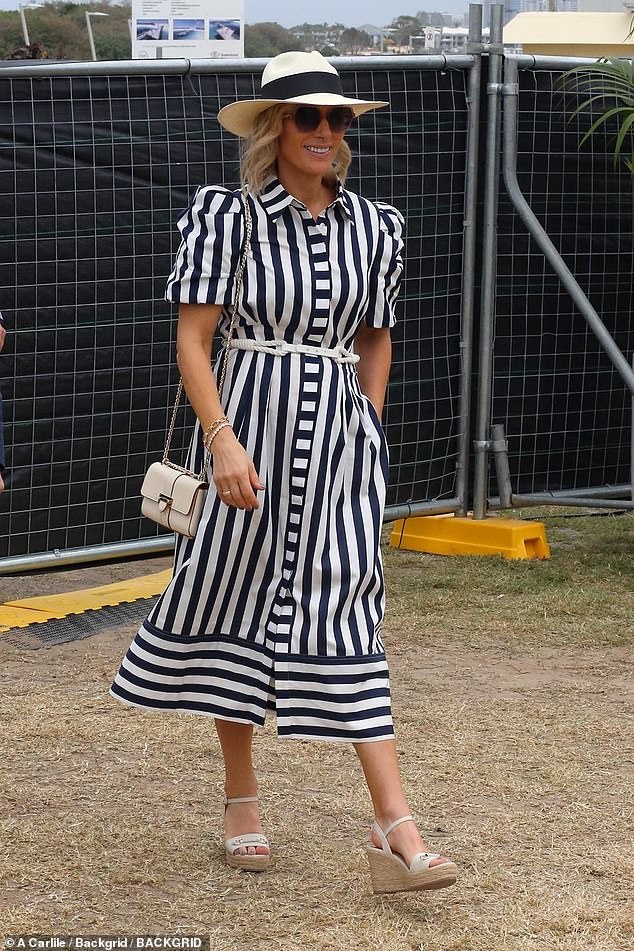 Zara put her belongings in a cream leather clutch and accessorised with a selection of bracelets today