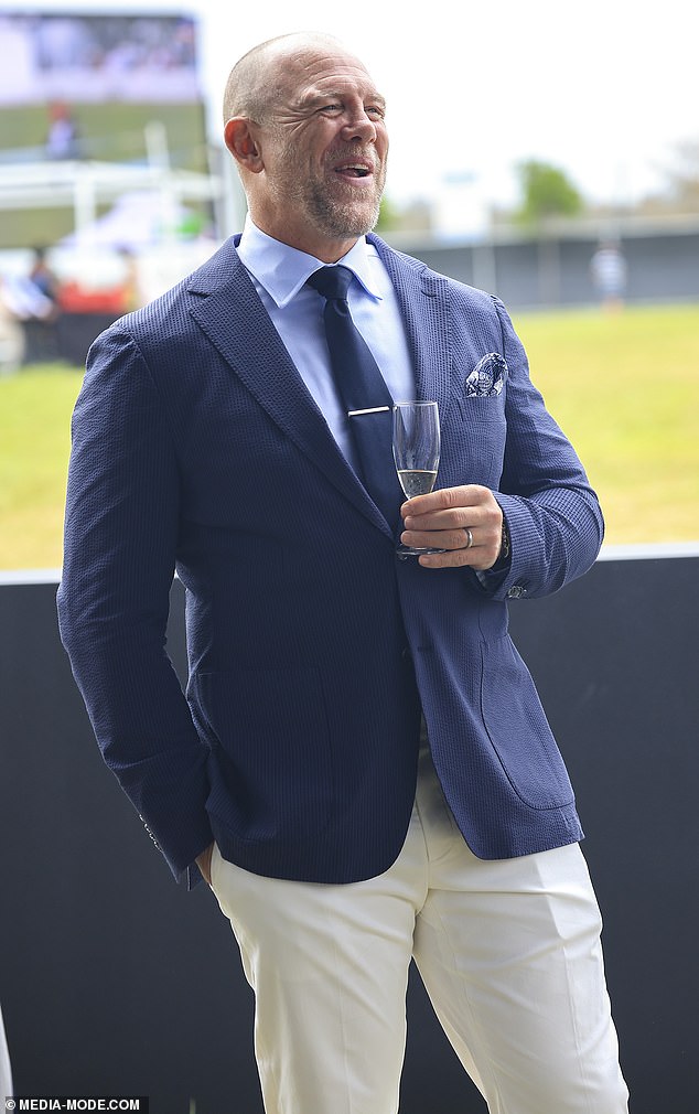 He laughed while seemingly enjoying a chat with another guest at the event, taking place in Australia