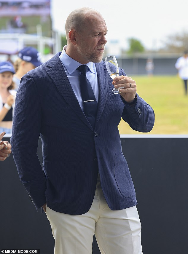 Zara' husband opted for a single-breasted blazer, worn over a cornflower blue shirt and navy tie