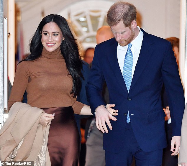 Prince Harry looks down as they emerge from Canada House. The following day they would announce their intention to step back from royal duties and spend more time in North America