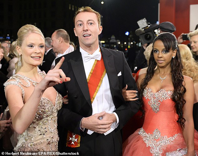 Socialites Cat Boe, Mario-Max, and Bahati 'Kolibri' Venus arrive for the Vienna Opera Ball at the State Opera in  2014