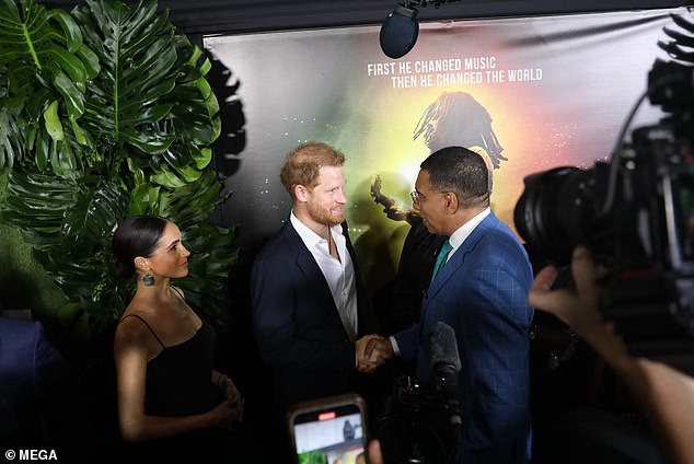 Harry, 39, shakes hands with Jamaica's prime minister, Andrew Holness