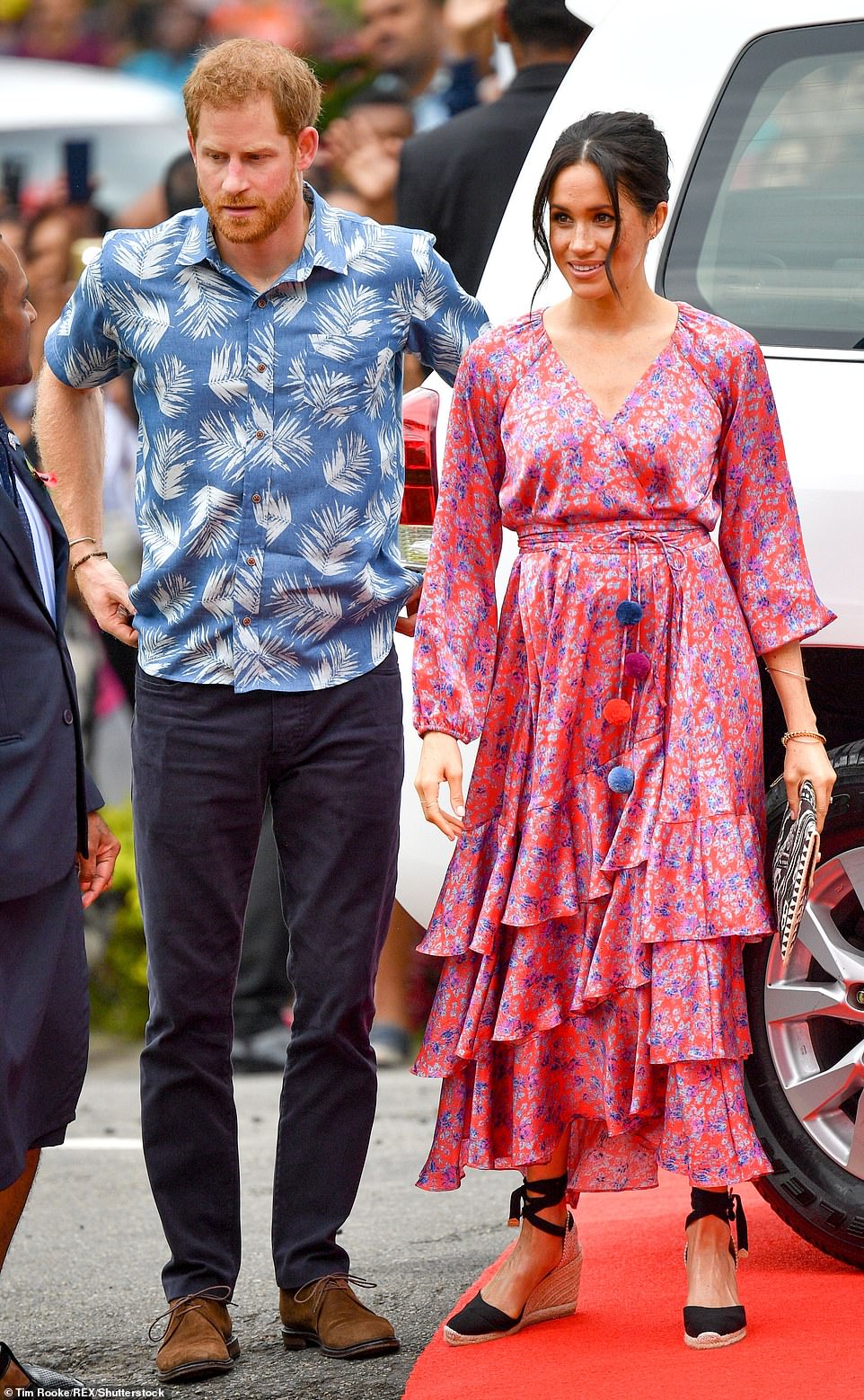 It's also a marked contrast from Meghan's previous island looks, such as her soft floral ensembles during a 2018 trip across Australia, Fiji, Tonga and New Zealand.