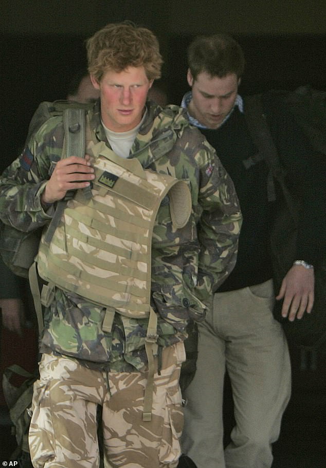 Prince Harry, left, walks with his brother Prince William, right, shortly after returning from active duty in Afghanistan, at the Brize Norton air base in Oxfordshire