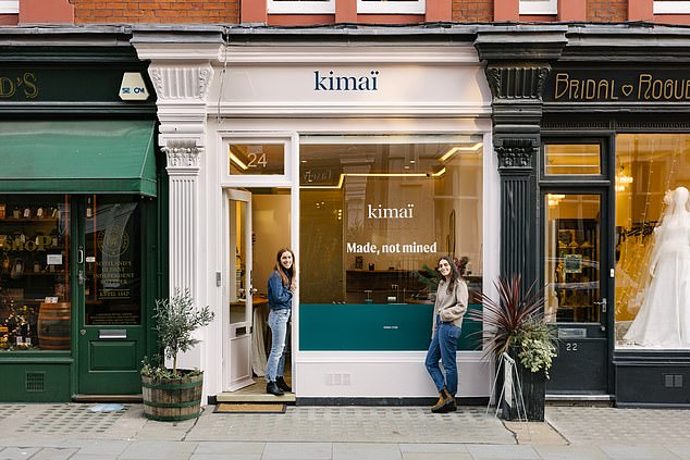 The company's owners post outside their smart shop off Baker Street, central London