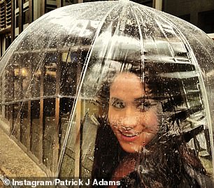 One of them was a black-and-white portrait of Meghan, who turned to look at the camera with her hand resting against her lips. Another showed her playfully sheltering under an umbrella