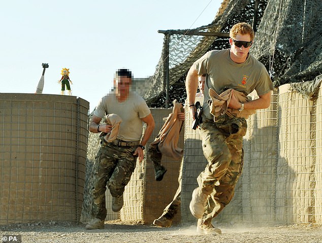 Captain Wales as he was known in the British Army, races out from the VHR (very high readiness) tent to scramble his Apache with fellow Pilots