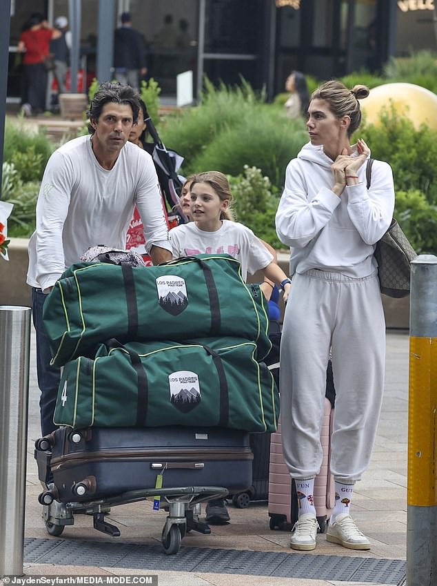 Nacho Figueras cut a dashing figure on Thursday when he was spotted arriving at Sydney Airport with his wife Delfina Blaquier and their daughter Alba. All pictured