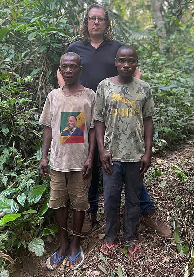 Reporter Ian Birrell with two Baka men who say they were beaten