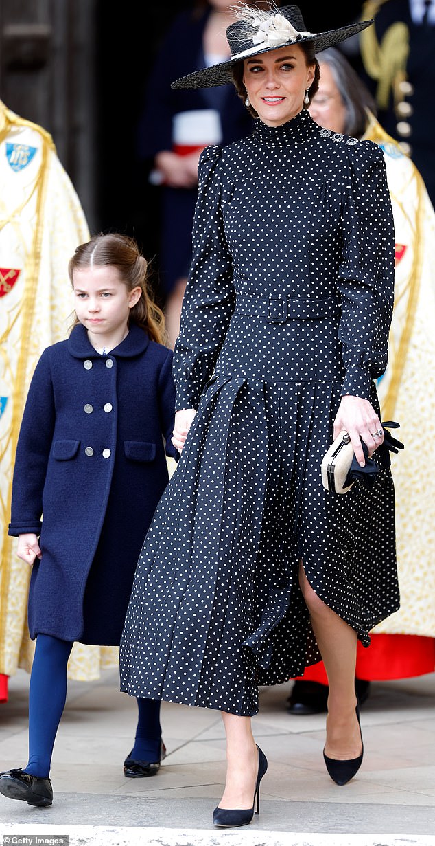 Catherine with daughter Charlotte in hand attendsd Prince Philip's Service of Thanksgiving in essandra Rich dress