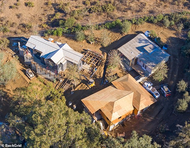 During a dramatic operation in the early hours of Monday morning, LA firefighters rescued 16 people from nine properties in Studio City - the same neighborhood where George Clooney lives in his $2.2 million luxury pad (pictured)