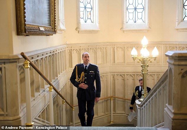 Prince William prepares to perform an investiture ceremony at Windsor Castle today