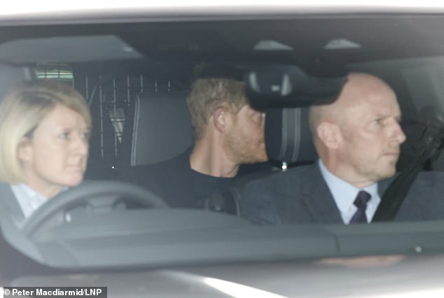 Prince Harry is pictured arriving at Clarence House in London yesterday to meet his father