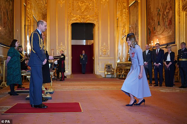 William regularly hands out honours on behalf of the King (he is seen here with England footballer Ellen White)