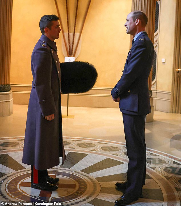 William chats with one of soldiers taking part in this morning's investiture ceremony