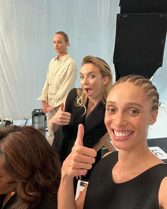 British model Adwoa Aboah gives a thumbs up with actress Jodie Comer with Amber Valletta in the background during the historic shoot