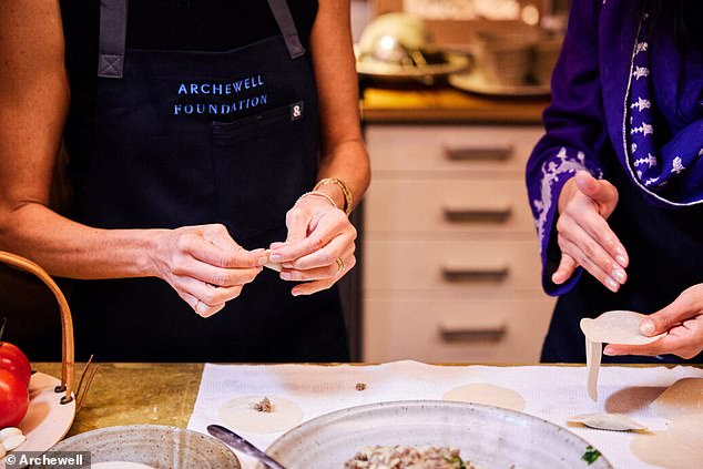 The women showed Megan how to fill the dumplings and fold them correctly so they keep their shape while cooking (pictured above)