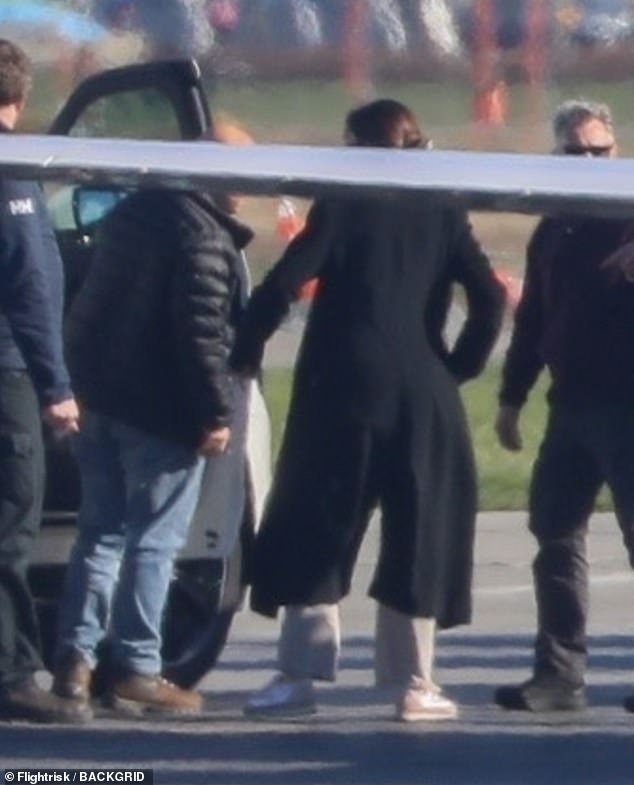 The scene at Vancouver Airport yesterday after Harry arrived for the Invictus Games events