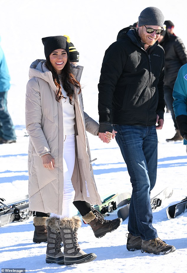 Meghan was glamorous in skinny white jeans and a sweater topped with a beige quilted coat while Harry was dressed down in jeans and a black anorak