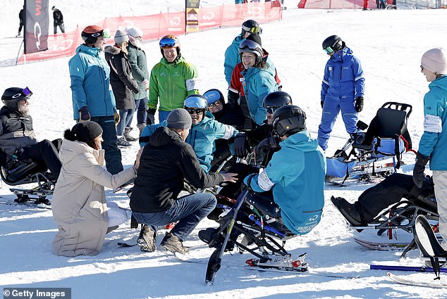 The couple were spotted bending down to talk to athletes competing at the games during yesterday's event