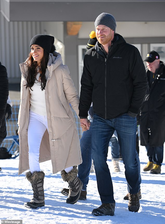 The couple were hand in hand as they walked onto the mountain