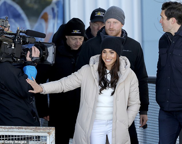 Harry and Meghan were pictured alongside GMA host Will Reeve (right) - son of Superman actor Christopher Reeve - on Wednesday