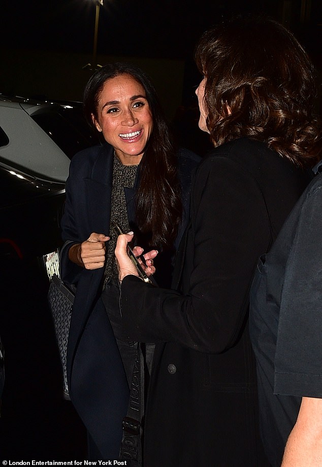 The Duchess of Sussex , 42, beamed as she arrived at the Asanebo Restaurant in Studio City on Thursday