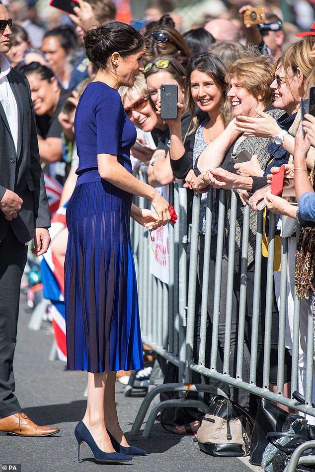 The Duchess of Sussex appeared to have a 'Diana moment' in New Zealand as she looked to have flashed her legs through her semi-sheer Givenchy skirt on October 31, 2018