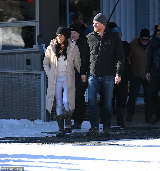 Meghan looked glamorous in skinny white jeans and a sweater topped with a beige quilted coat while Harry was dressed down in jeans and a black anorak