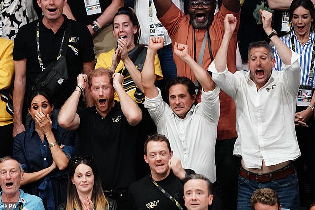 The Duke and Duchess of Sussex with Minister for Veterans' Affairs Johnny Mercer watch the sitting volleyball final at the Merkur Spiel-Arena during the Invictus Games in Dusseldorf, Germany, on September 15