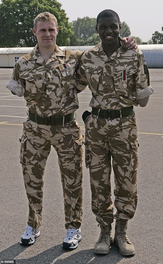 Ben, who lives in Plymouth, who was described as a hero by Prince Harry, smiles as he and triple amputee Mark Ormrod (left) receive their medals for serving in Afghanistan