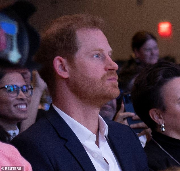 Harry is seen in the audience as she supports his wife Meghan while she speaks in the panel