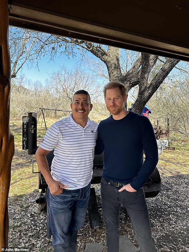 Prince Harry is pictured with Carlos Martinez - a relative of heroic schoolteacher Irma Garcia who sacrificed her own life during the massacre