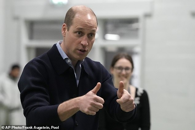 Prince William gestures during his visit to the new OnSide Youth Zone in West London today