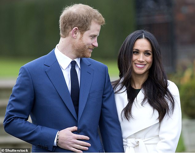 Prince Harry and Meghan Markle stand outside Kensington Palace after announcing their engagement in November 2017