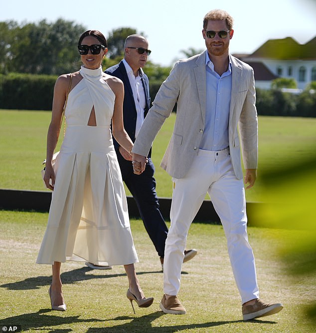 Meanwhile Harry opted for a pair of cream trousers, a pale grey jacket, a crisp blue shirt, and some slip-on tan shoes - before changing into his team uniform and taking to the field