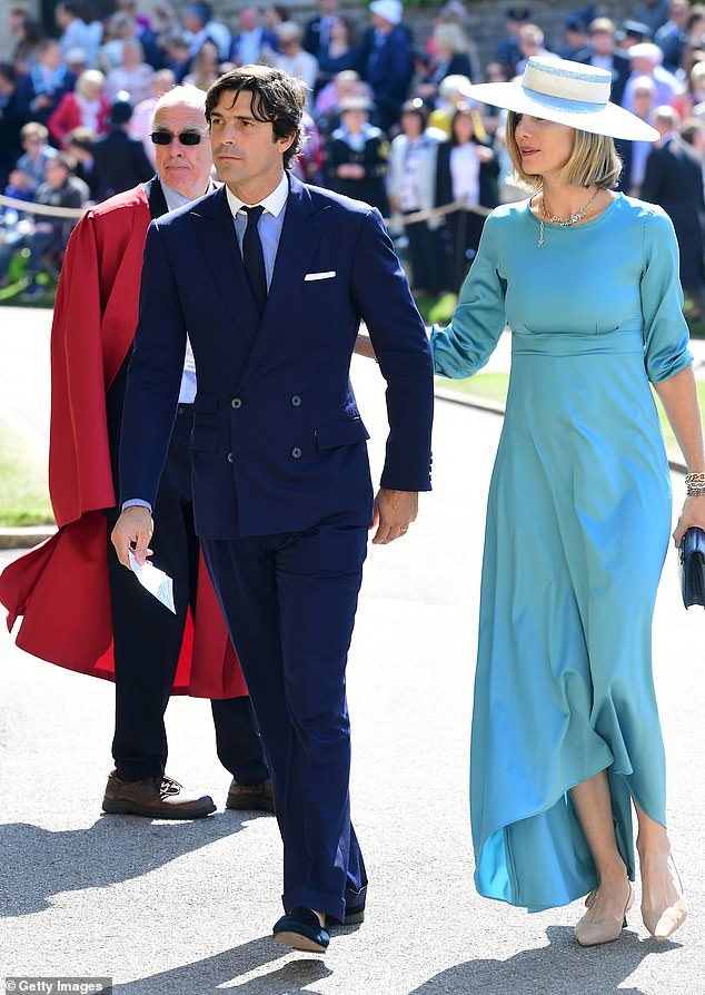 A royal affair: the couple posed at St. George Chapel to celebrate the wedding of Prince Harry to Meghan Markle, their close friends; pictured May 2018