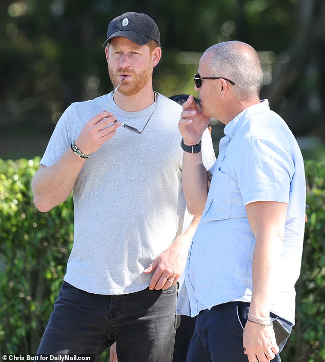 The Prince cut a low-key figure in black jeans and a grey t-shirt - but his arrival was given away by a Netflix film crew who were on hand to shoot his interactions with the awe-struck players