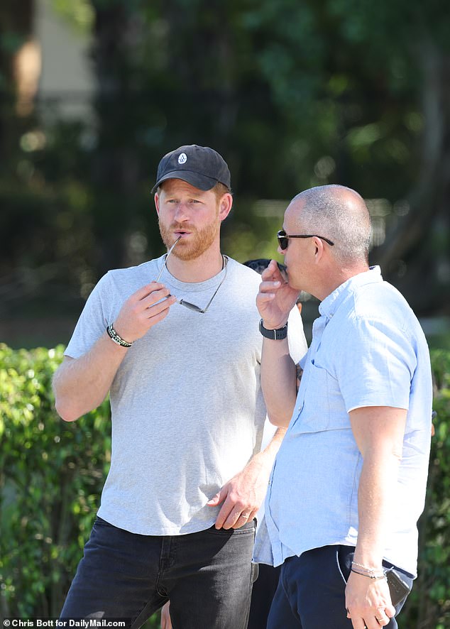 The Prince cut a low-key figure in black jeans and a grey t-shirt - but his arrival was given away by a Netflix film crew who were on hand to shoot his interactions with the awe-struck players