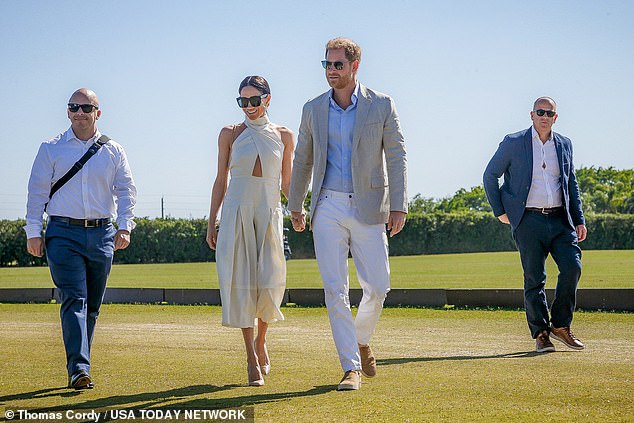 The pair shared a kiss as Meghan handed over the trophy, in a display body language expert Judi James says indicates the Duchess 'is enjoying [Harry] play the sporting hero'