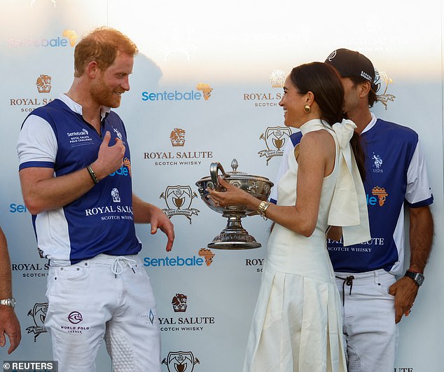 The One Stud White Leather Crossbody Bag is a favourite of Meghan's who has worn it several times before, but it wasn't her elegant silk gown that caught the attention of royal watchers