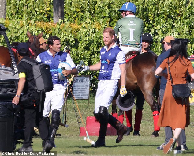 Harry is seen here following the match in Florida on Friday