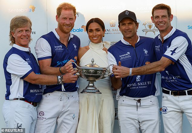 Meghan took center stage as the team gathered around to celebrate their win