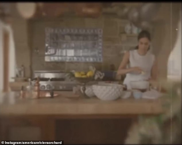 Meghan announced her new business venture, American Riviera Orchard, with a clip which showed the Duchess cooking in a kitchen with copper pans hanging over her head as she whisked